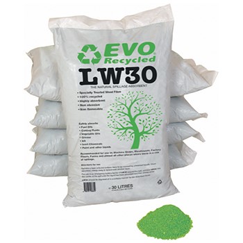 Bags of spill absorbing granules next to pile of green granules
